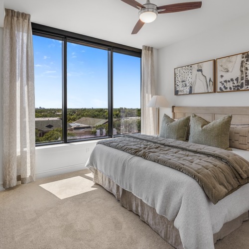Bedroom with natural lighting and high ceilings
