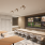 Rendering of screening lounge, with six screens , coworking tables with chairs